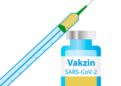 Spritze und Ampulle Vakzin SARS-CoV-2