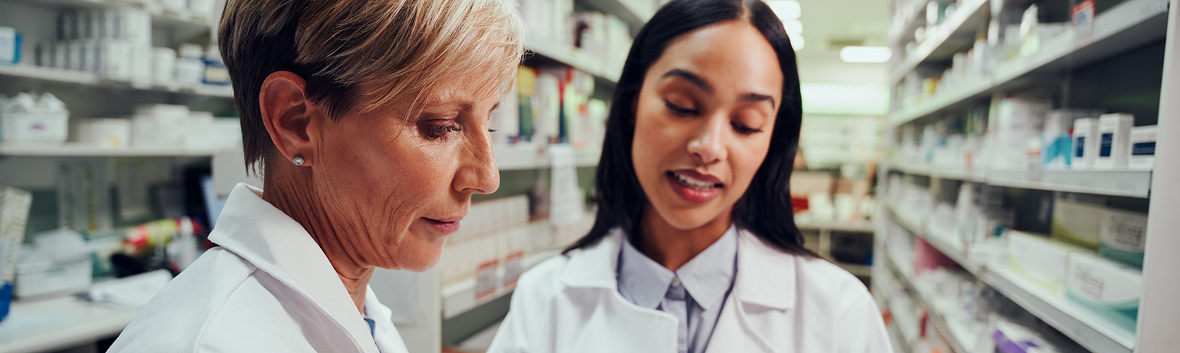 2 pharmacists with a tablet in the medication storage room 